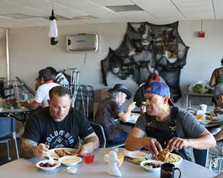 Residents of the Jon W. Paulson Veterans Community share a meal.