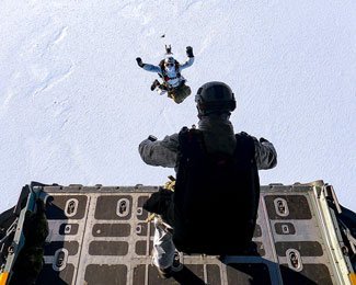 Naval Special Warfare members perform a high-altitude low-opening jump during the 2022 Arctic Edge Exercise. Photo by Mass Communication Spc. 2nd Class Trey Hutcheson, courtesy of the U.S. Navy.