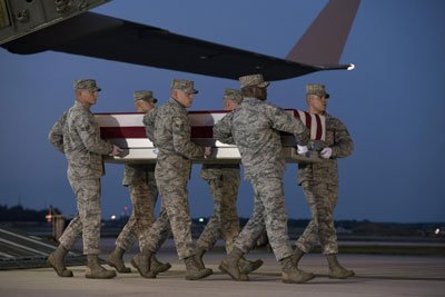 The dignified transfer of Air Force Maj. Troy Gilbert. A 29-person team consisting of several members of Task Force 160, the unit that he died protecting, retrieved his body and escorted him home. Photo by Senior Airman Aaron J. Jenne, courtesy of the U.S. Air Force.