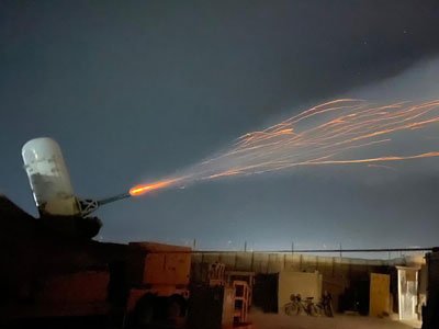 A Land-based Phalanx Weapon System fires at Al Asad Air Base, Iraq. The LPWS is part of the Counter Rocket, Artillery, Mortar (C-RAM) system that Cameron McMillan’s battery used to help protect coalition troops and assets from rockets and drones fired by Iranian-aligned militias. Photo courtesy of the author.