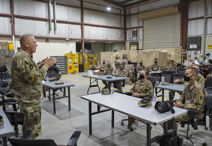 Maj. Gen. Patrick Hamilton attends class on extremism in the ranks led by Lt. Col. David Green, staff judge advocate, 36th Infantry Division, in the motor pool at Camp Arifjan, Kuwait, Mar. 18, 2021. 