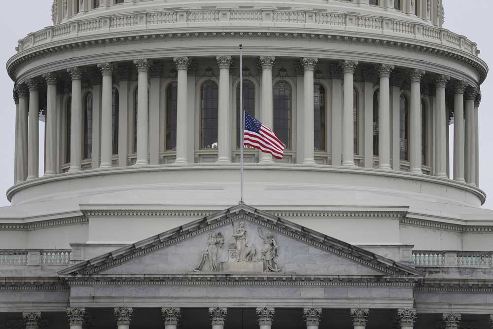 The U.S. flag at the Capitol building flies at half-staff for fallen Capitol Police officer Brian Sicknick on Jan. 11, 2021, after the insurrection at the Capitol on Jan. 6, 2021. 
