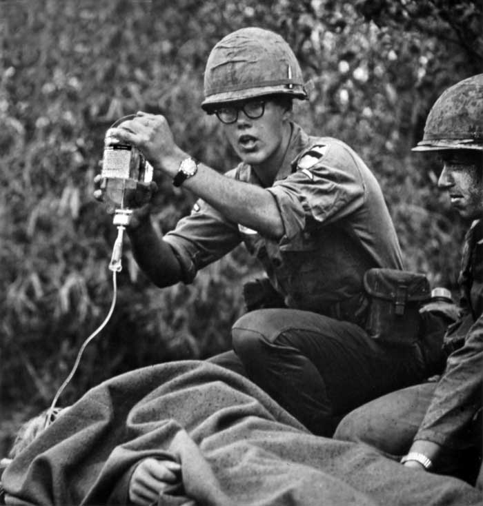 A medic delivers plasma to a wounded infantryman of the 1st Battalion, 12th Cavalry.
